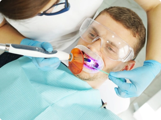 A doctor treats a patient's teeth